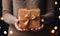 Photo of a Person Excitedly Holding a Festively Wrapped Gift