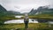 Photo of a person standing in a field with a backpack. Wanderlust