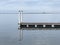 Photo of a pier with reflections