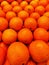 Photo of a pile of oranges in a supermarket