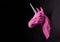 Photo of pink origami unicorn`s head.