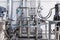 Photo of pipes and tanks. Chemistry and medicine production. Pharmaceutical factory. Interior of modern production