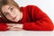 Photo of pleased woman looking at camera while leaning on table