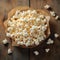 Photo Popcorn on paper, wooden background, top view with space