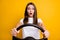 Photo portrait of afraid fear brunette girl holding steering wheel driving first time  vivid yellow color