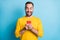 Photo portrait of amazed man wearing yellow outfit reading news smartphone staring smiling isolated on bright blue color