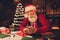 Photo portrait amazed santa wearing glasses using smartphone browsing internet