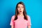 Photo portrait of astonished shocked brunette staring with opened mouth isolated on vibrant blue color background