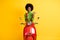 Photo portrait of biker driver motorcyclist red scooter rider with brunette afro holding cellphone pointing thumb side