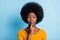 Photo portrait of black skinned girl keeping finger near lips speechless quietly isolated on vibrant blue color