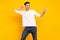 Photo portrait brunet guy in casual outfit chilling on holidays dancing overjoyed isolated vibrant yellow color