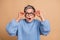 Photo portrait of cute grandmother astonished reaction touch specs dressed stylish blue knitted garment isolated on