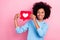 Photo portrait of cute pupil girl hold social media love heart icon smile dressed stylish blue clothes isolated on pink