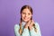 Photo portrait of cute thankful girl  on vivid purple colored background