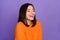 Photo portrait of cute young girl laughing have fun joke humor wear trendy knitwear orange clothes isolated on violet