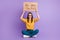 Photo portrait of depressed sad girl keeping table cardboard looking for job sitting down isolated on vivid purple color
