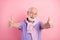 Photo portrait of elder man cheerful overjoyed showing thumb-up like sign isolated on pastel pink color background