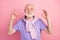 Photo portrait of elder man happy positive man showing okay gesture with fingers isolated on pastel pink color