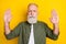 Photo portrait of elder man serious showing stop enough sign with hands isolated vivid yellow color background