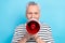 Photo portrait of funny old male hold loudspeaker announce news wear trendy striped garment isolated on blue color
