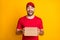 Photo portrait of funny staring opened mouth man keeping carton box for delivery in red uniform isolated on vibrant