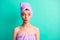 Photo portrait funny woman turban on head doing spa procedures pouted lips looking at copyspace isolated vibrant teal