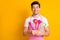 Photo portrait of guy holding bunch of kitchen utensils looking at blank space isolated on vivid yellow colored