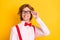 Photo portrait of guy with red hair smiling in spectacles shirt suspenders isolated on vibrant yellow background