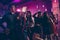 Photo portrait of guys and girl dancing together at nightclub laughing chilling having good mood