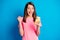 Photo portrait of happy female student gesturing like winner reading information internet isolated on bright blue color