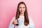 Photo portrait of happy girl drinking coffee on work break smiling isolated on pastel pink color background