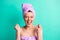 Photo portrait happy surprised woman turban on head rejuvenation in shower shouting with closed eyes isolated vivid teal