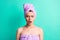 Photo portrait irritated woman turban on head after shower staring angry opened mouth isolated bright teal color