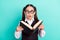Photo portrait little girl in glasses amazed excited reading book opened mouth isolated pastel turquoise color