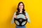 Photo portrait of lovely young lady holding steering wheel excited driver dressed stylish striped look isolated on