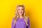 Photo portrait of lovely young lady look interested up toothy smile dressed stylish violet garment isolated on yellow