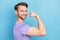 Photo portrait of man positive nice showing powerful arm isolated on pastel blue color background