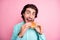 Photo portrait of man about to bite cheeseburger isolated on pastel pink colored background