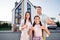 Photo portrait of parents mother father spending time with small daughter outside new house showing thumb-up like sign