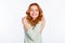 Photo portrait of red haired girl dreamy positive overjoyed hugging herself laughing isolated white color background