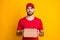 Photo portrait of serious confident courier keeping carton box for delivery in red uniform cap isolated on bright yellow