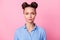 Photo portrait of serious confident woman wearing blue dotted shirt isolated on pastel pink color background