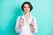 Photo portrait of serious female doctor wearing white uniform with stethoscope isolated vivid teal color background