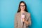 Photo portrait of serious news anchor with microphone isolated on vivid blue colored background