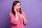 Photo portrait of shocked stressed girl talking on cellphone touching chest staring copyspace isolated on vibrant purple