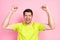 Photo portrait shouting brunet man wearing bright t-shirt amazed gesturing like winner isolated pastel pink color