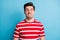 Photo portrait of silly comic man grimacing fooling in striped t-shirt isolated on bright blue color background