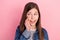 Photo portrait of small girl curious looking copyspace telling secret  on pastel pink color background