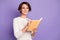 Photo portrait of smart girl writing in organizer wearing glasses smiling isolated on pastel purple color background