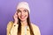 Photo portrait of smiling curios girl looking empty space in yellow jacket isolated on pastel violet color background